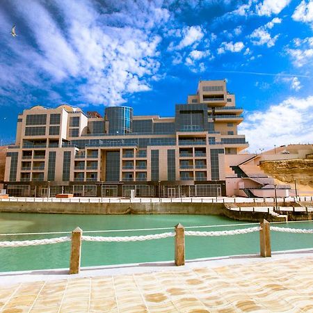 Caspian Riviera Grand Palace Hotel Aqtau Esterno foto The new building of the University of Jordan