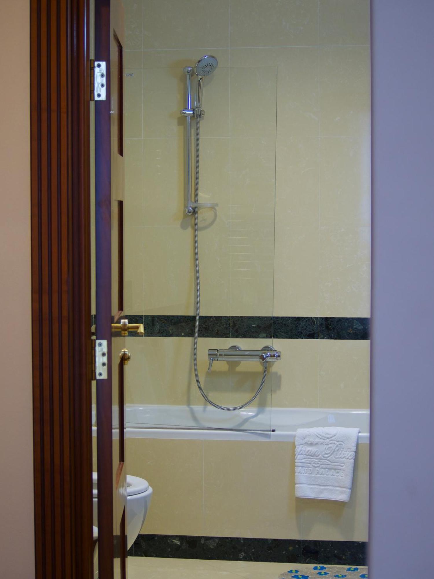Caspian Riviera Grand Palace Hotel Aqtau Esterno foto A shower with a thermostatic valve