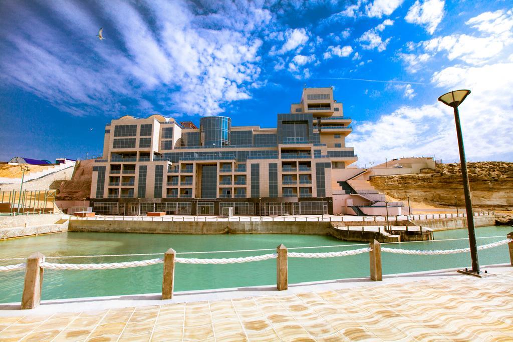 Caspian Riviera Grand Palace Hotel Aqtau Esterno foto The new building of the University of Jordan